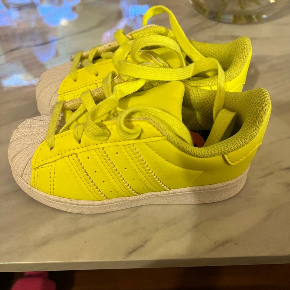 Fluorescent yellow/ white gently used shell toe adidas. Worn 2x.